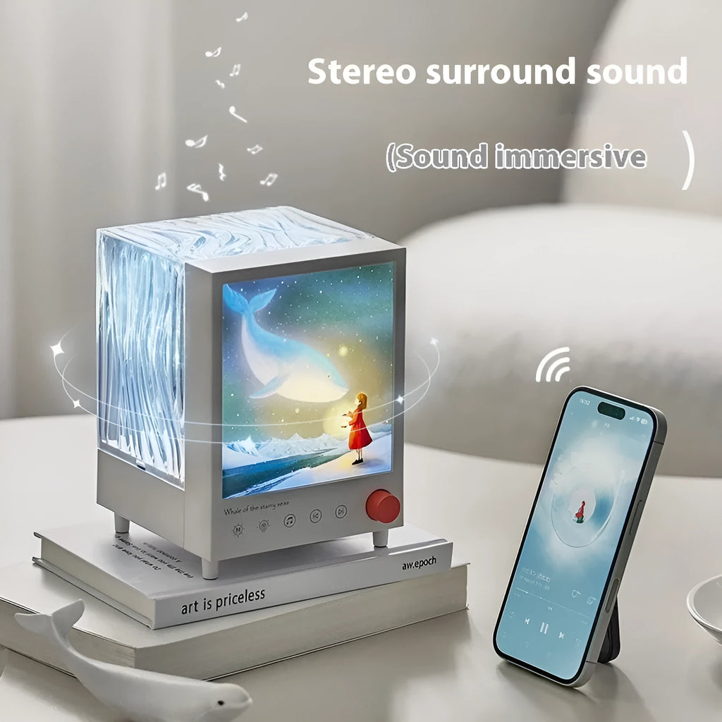 Aurora Treasure Box projection lamp projecting star sea whale light pattern, with Bluetooth speaker.