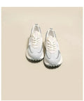 Women's grey and pink low-top retro sneakers with a round toe and flat rubber sole.