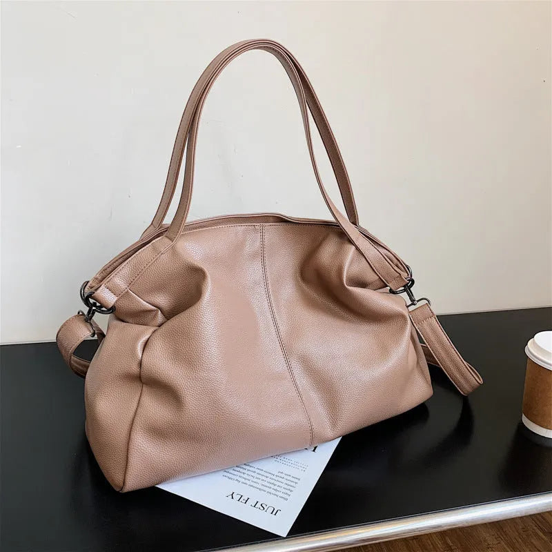 Soft surface large messenger tote bag in black with zipper opening and adjustable shoulder strap