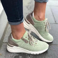 Women's fashion lace-up sneakers with round toe, thick sole, and flat heel in beige colour