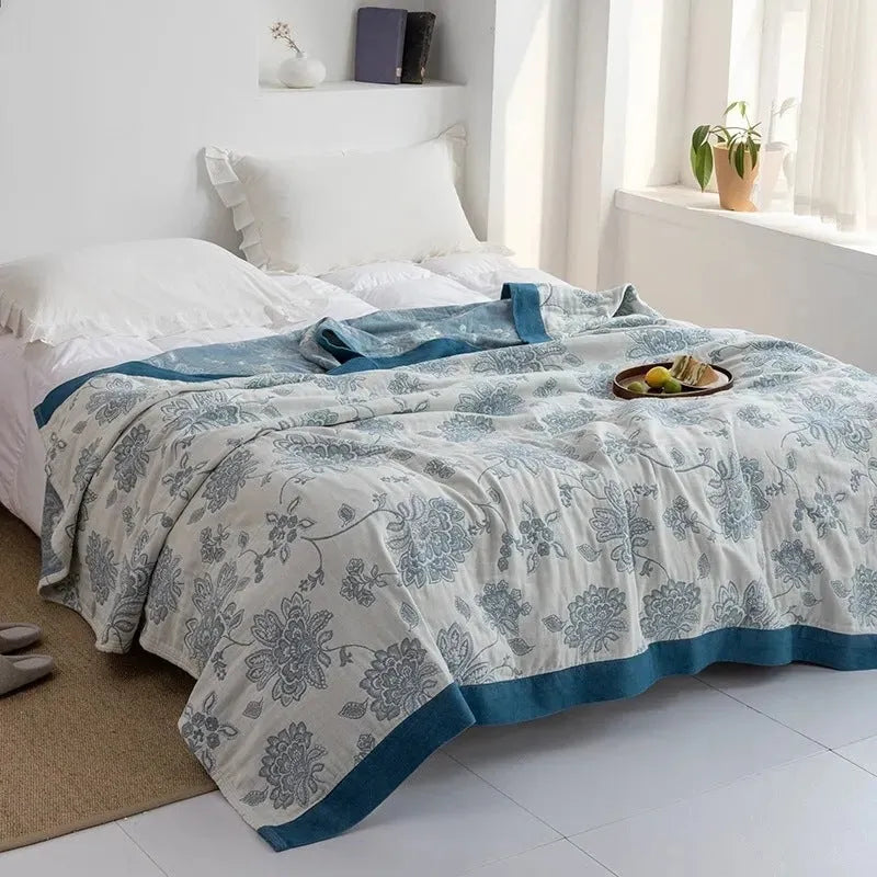 Five-layer cotton gauze bed sheet blanket in Roulette Wheel Blue pattern showing reactive dye printing detail