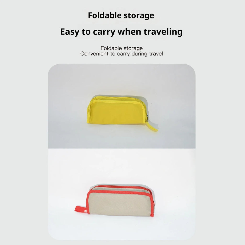 Foldable outdoor camp stool in Oxford cloth, shown in a khaki colour, compactly folded with carry handle.