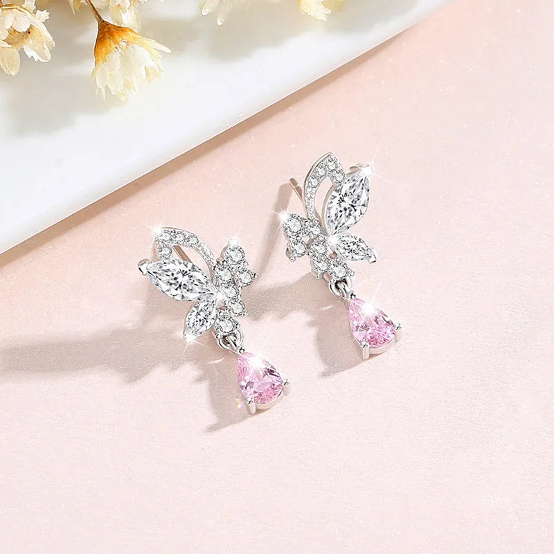 A pair of women's sterling silver stud earrings with a butterfly design and clear crystal accents.