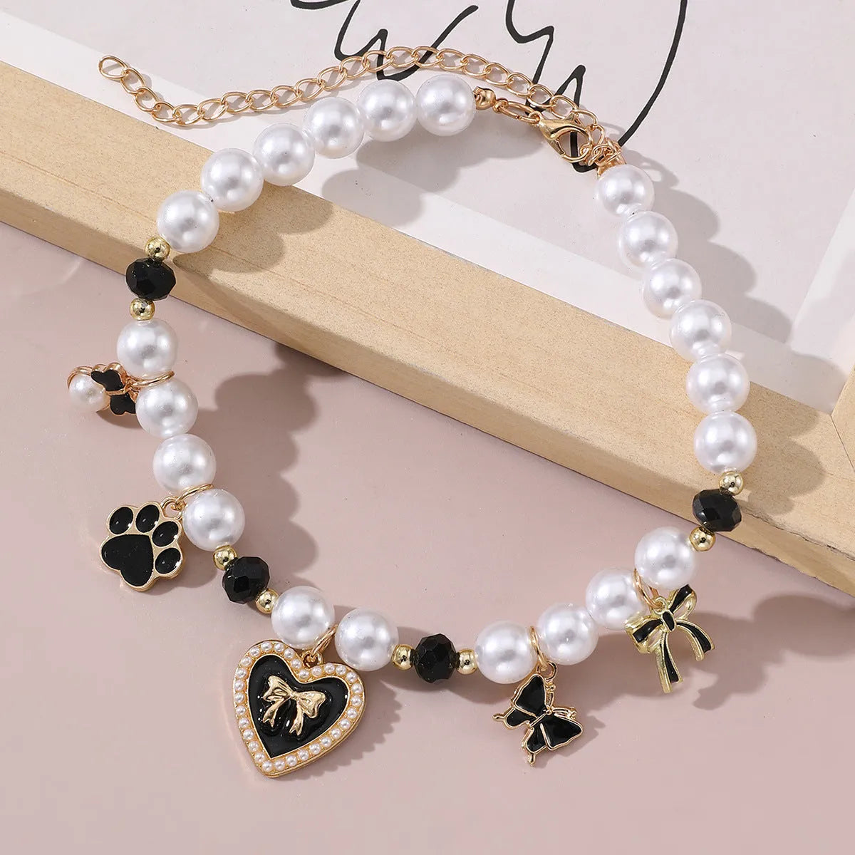 Cartoon pattern pearl pendant pet necklace in black and white for small to medium pets