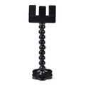 Black plastic pet photography clip tool holding mobile phone with snack grip attachment