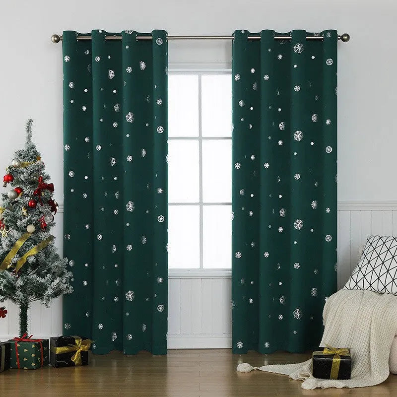 Red snowflake pattern shade cloth curtain with lace loop detailing hung on window