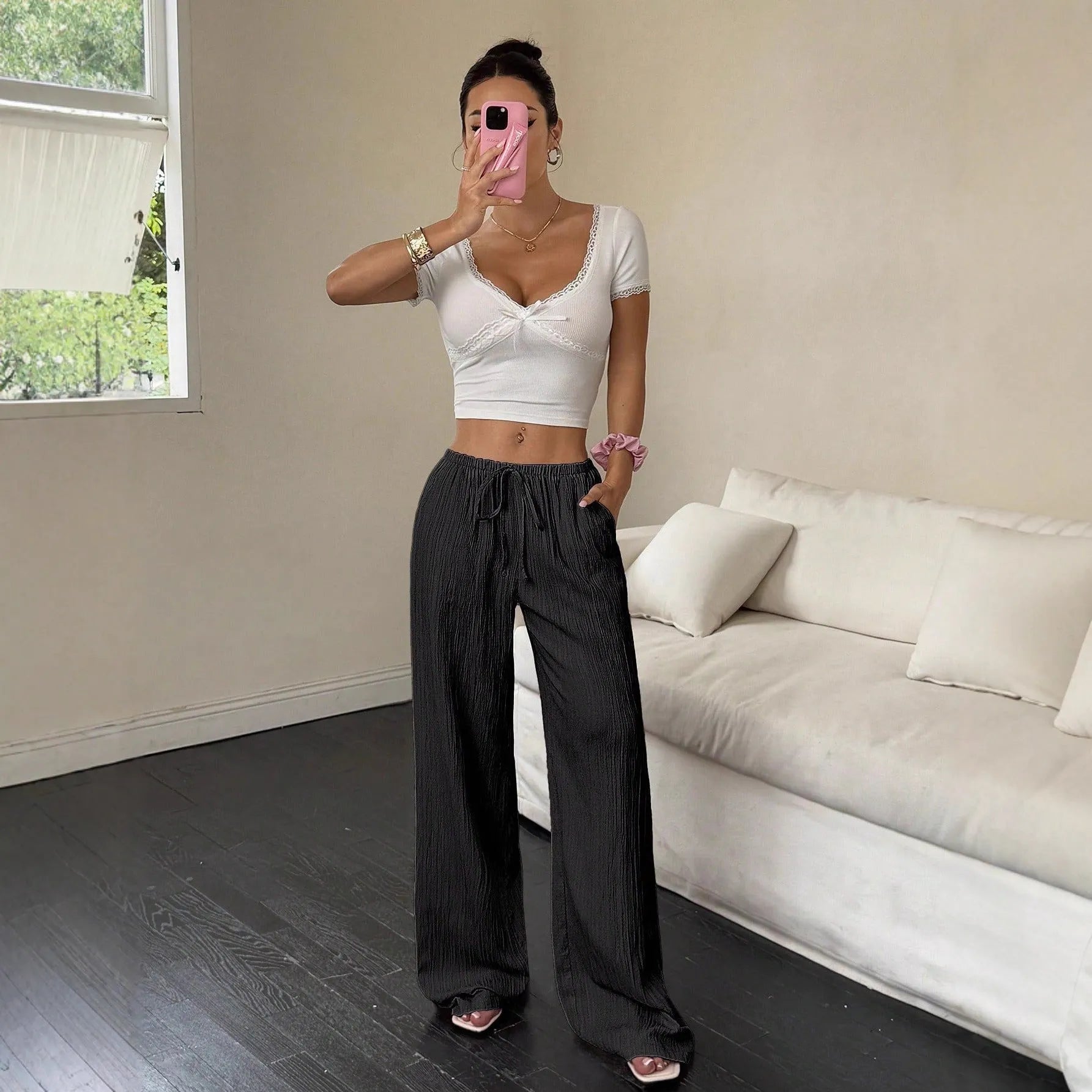 Women's wide-leg casual trousers with lace-up waist detailing in black or pink colour options