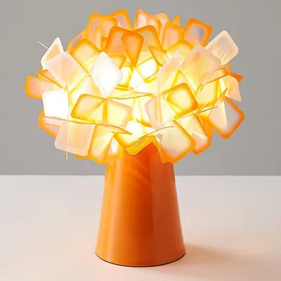 Nordic style metal table lamp in a choice of colours showing warm, white, and neutral light settings.