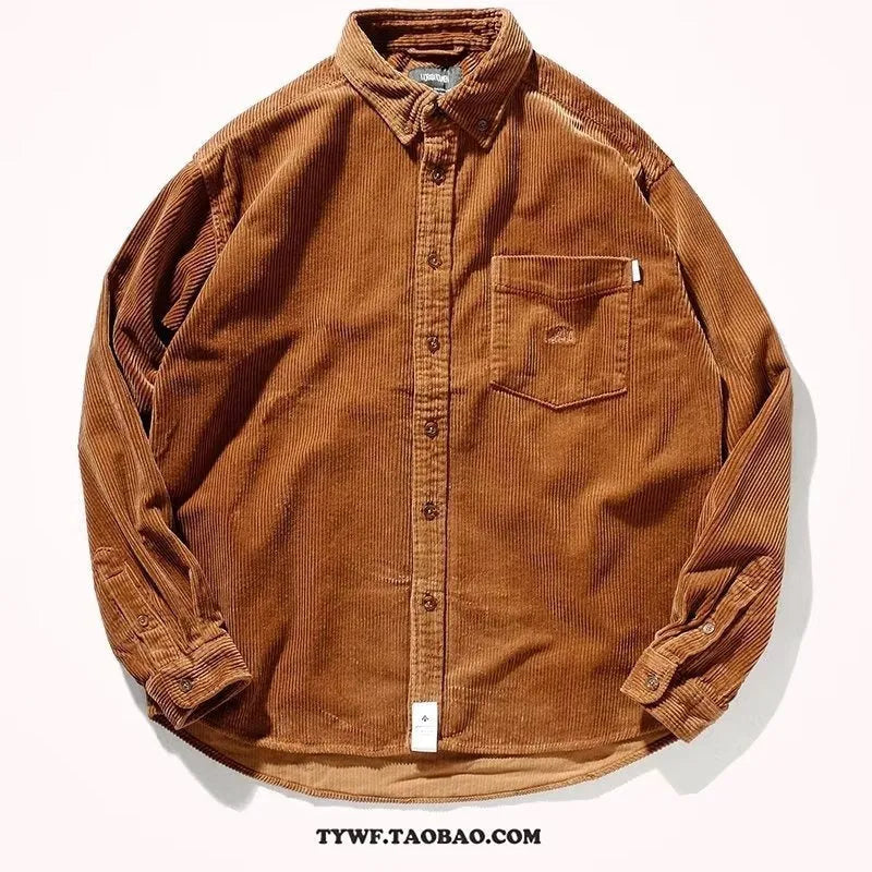 A caramel-coloured loose-fit corduroy long sleeve shirt laid flat, showing its cardigan-style cut and textured fabric.
