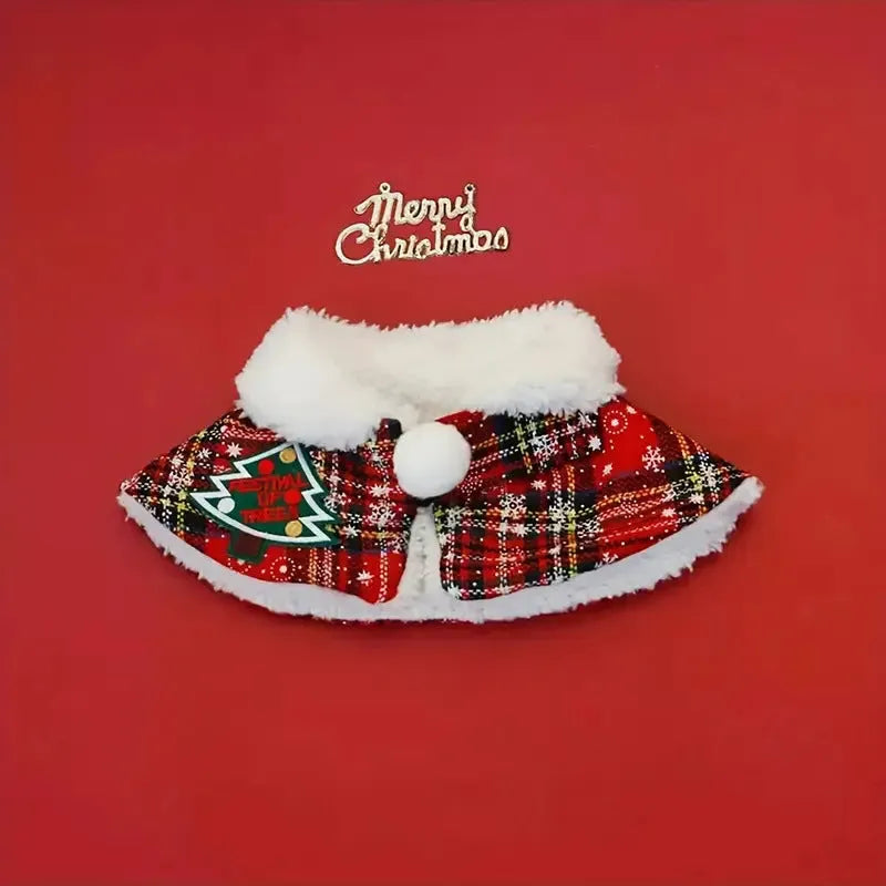 Red polyester pet scarf with white snowflake bell design wrapped around a dog's neck.