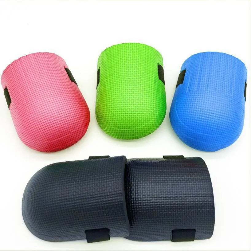 A pair of foam kneepads in four colour options: black, blue, green, and pink.