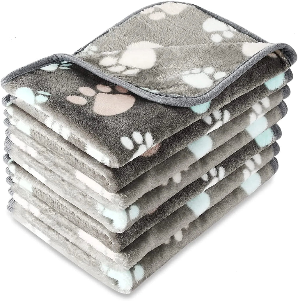 Coral fleece pet blanket with dog paw pattern in various sizes and colours