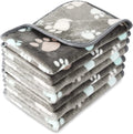Coral fleece pet blanket with dog paw pattern in various sizes and colours
