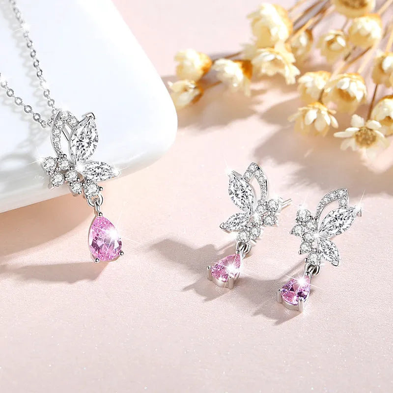 A pair of women's sterling silver stud earrings with a butterfly design and clear crystal accents.