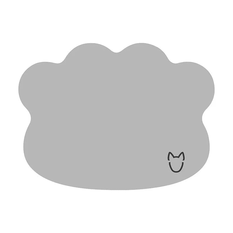 Dog head-shaped Ice Silk pet cooling mat on a hardwood floor, showing non-slip base and light gray colour.