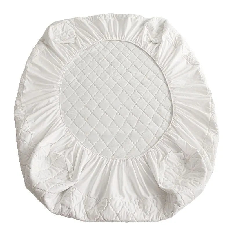 Diamond lattice quilted bamboo fibre waterproof mattress protector set with fitted sheet and pillowcases in grey.