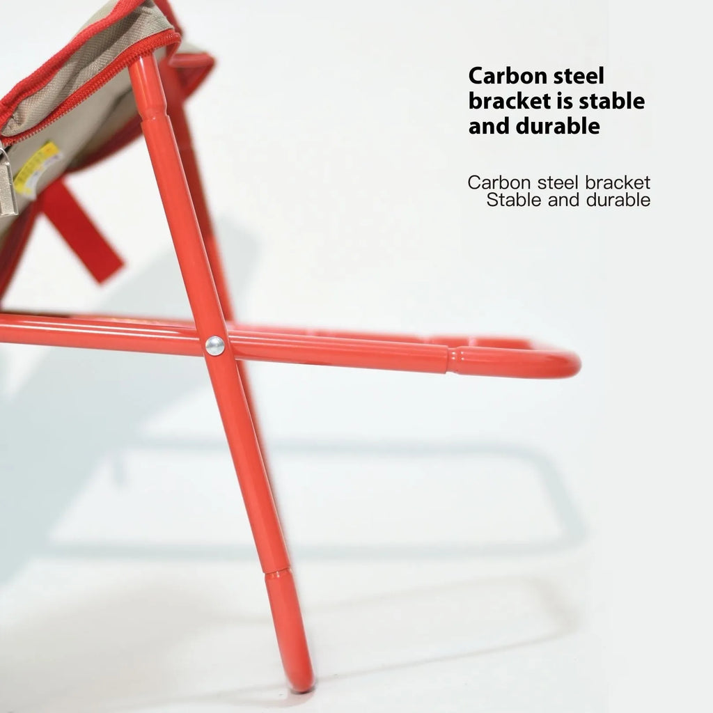 Foldable outdoor camp stool in Oxford cloth, shown in a khaki colour, compactly folded with carry handle.