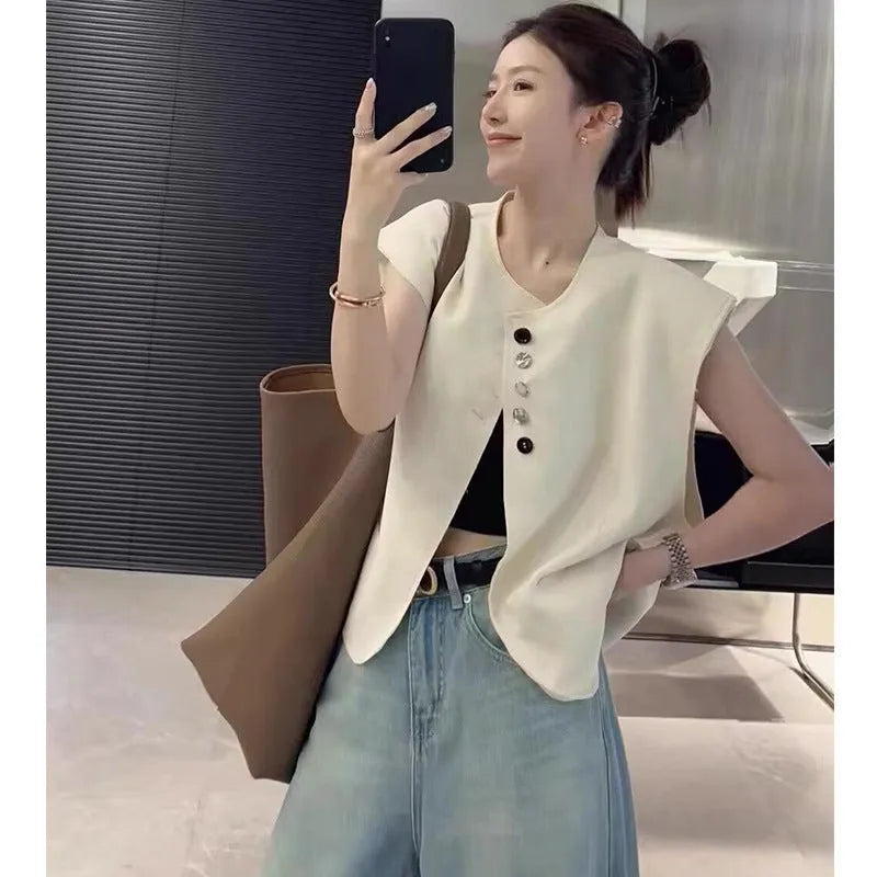 Women's loose fit polyester vest with pocket details in milky white colour