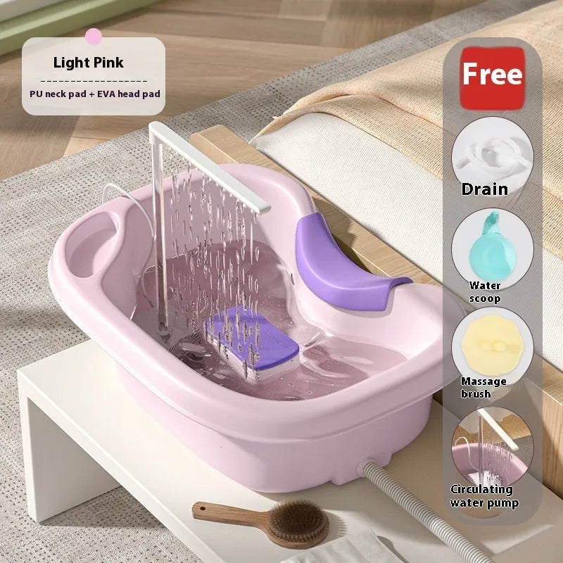 Light pink plastic shampoo basin for bed use with head pad, neck pillow, and water pump on bed
