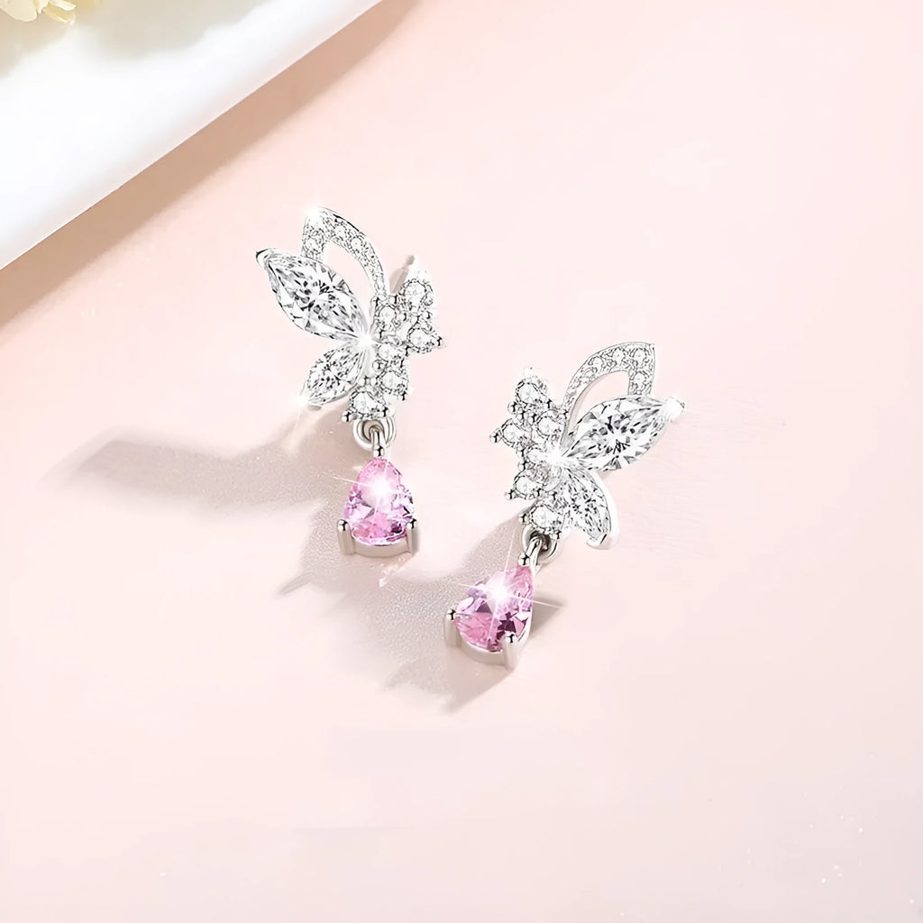 A pair of women's sterling silver stud earrings with a butterfly design and clear crystal accents.