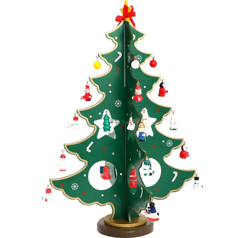 Hand-painted wooden Christmas tree decoration in red and green colours on desktop