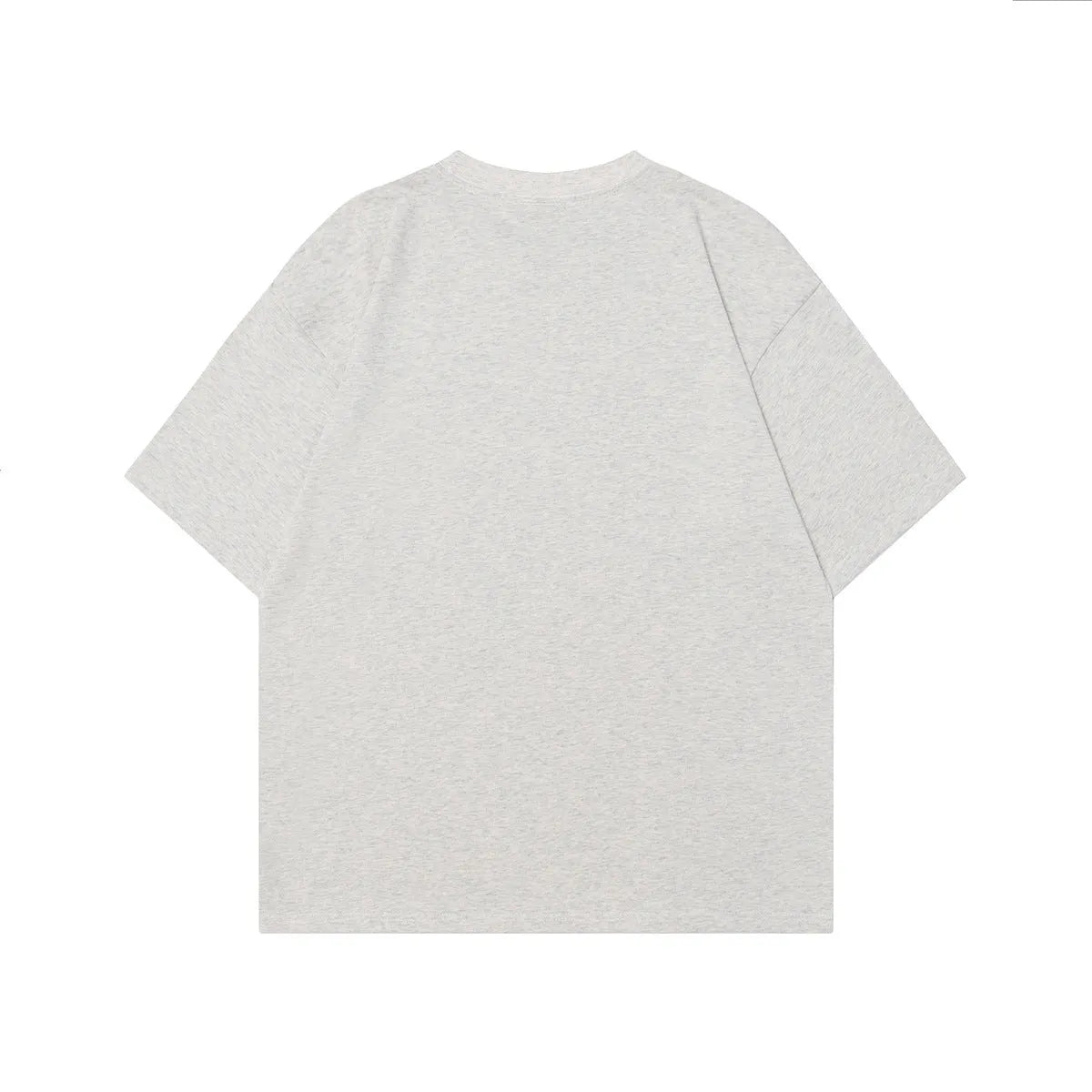 Men's grey cotton t-shirt with a retro character print, showing short sleeves and loose fit.