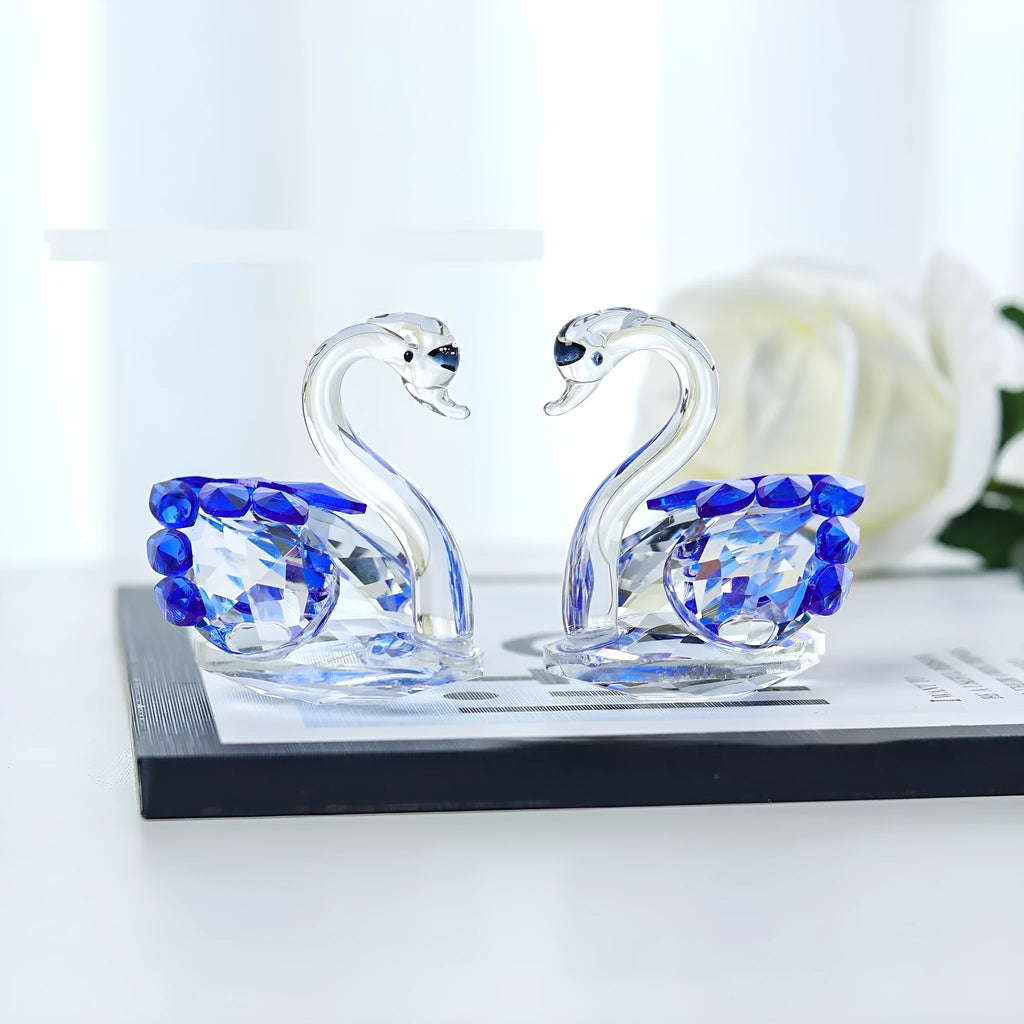 White crystal swan desktop decoration in red, blue, pink, or purple on a countertop