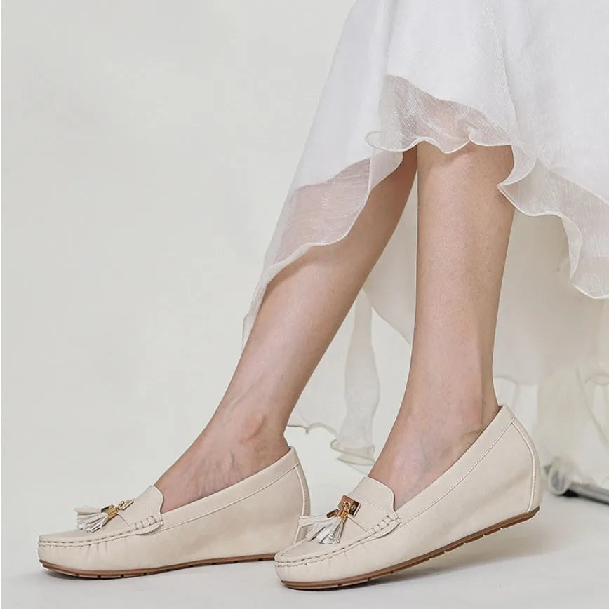 Women's beige height increasing insole casual work shoes with round toe and mid heel.