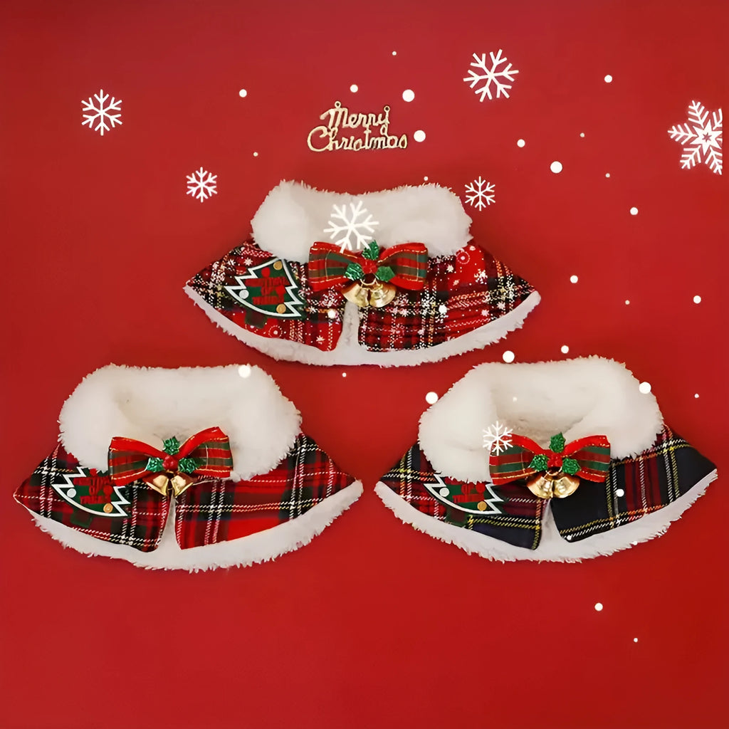 Red polyester pet scarf with white snowflake bell design wrapped around a dog's neck.