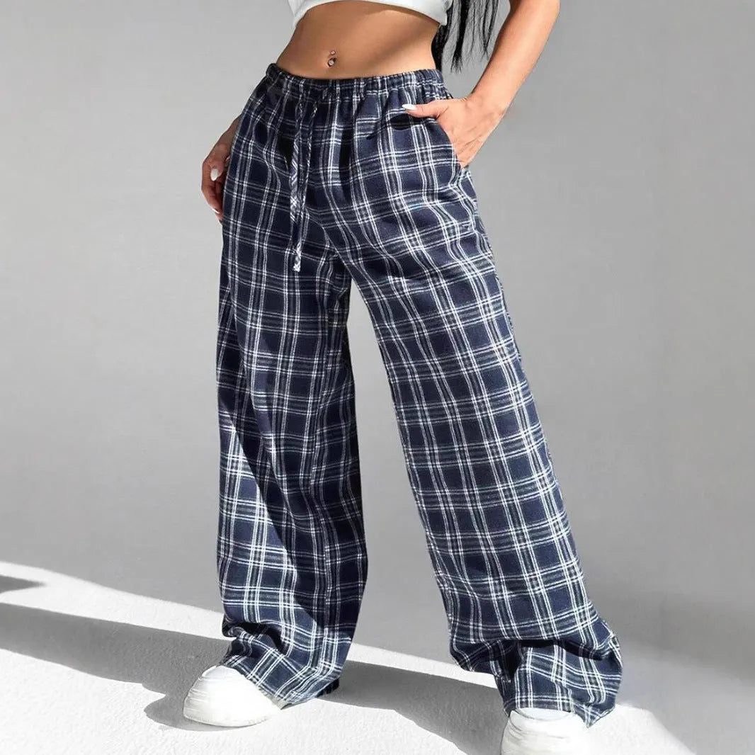 Women's loose fit plaid trousers with drawstring waist and patch pockets in casual styling