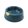 Green plastic double pet bowl for cats and dogs with anti-tipping base and separate food and water compartments