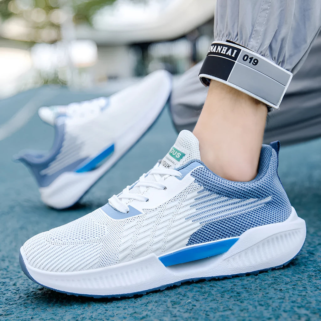 Men's blue casual mesh sports shoes with a round toe and cloth upper on a white background