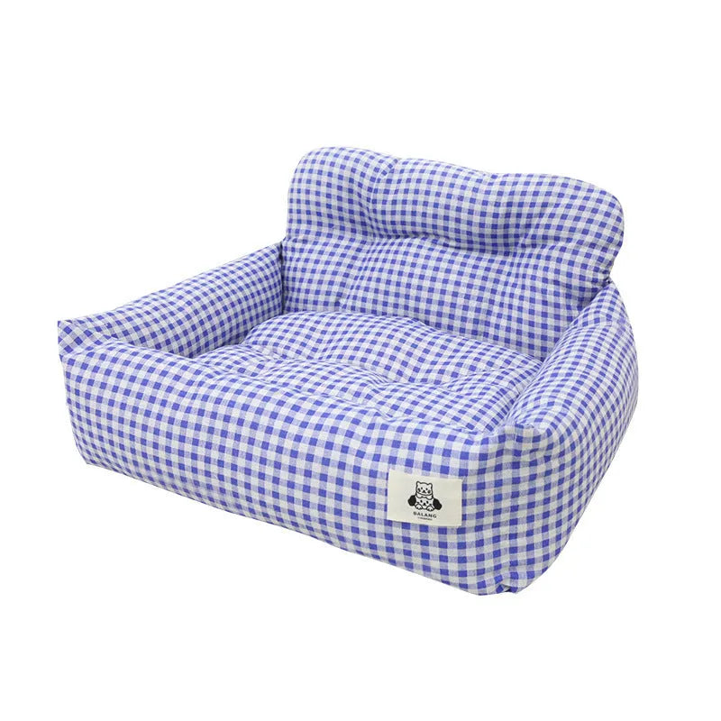 Car-mounted dog travel nest in stain-resistant cloth showing grey and blue plaid colour options