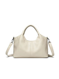 Women's genuine leather cross-body bag in seven colour options showing large capacity main compartment
