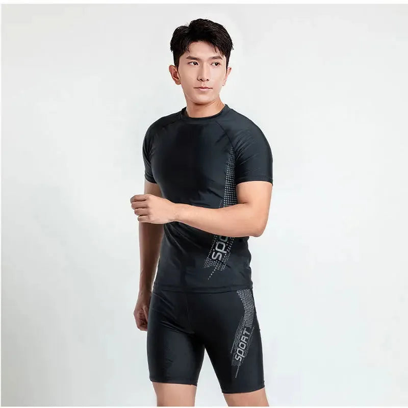 Men's plus size two-piece swim set with vest and trunks in polyester fabric.