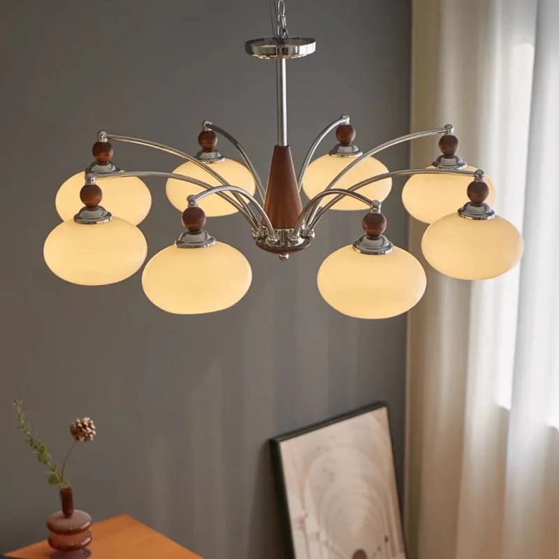 Creative persimmon glass and chrome chandelier with multiple light heads in Middle Ancient style.