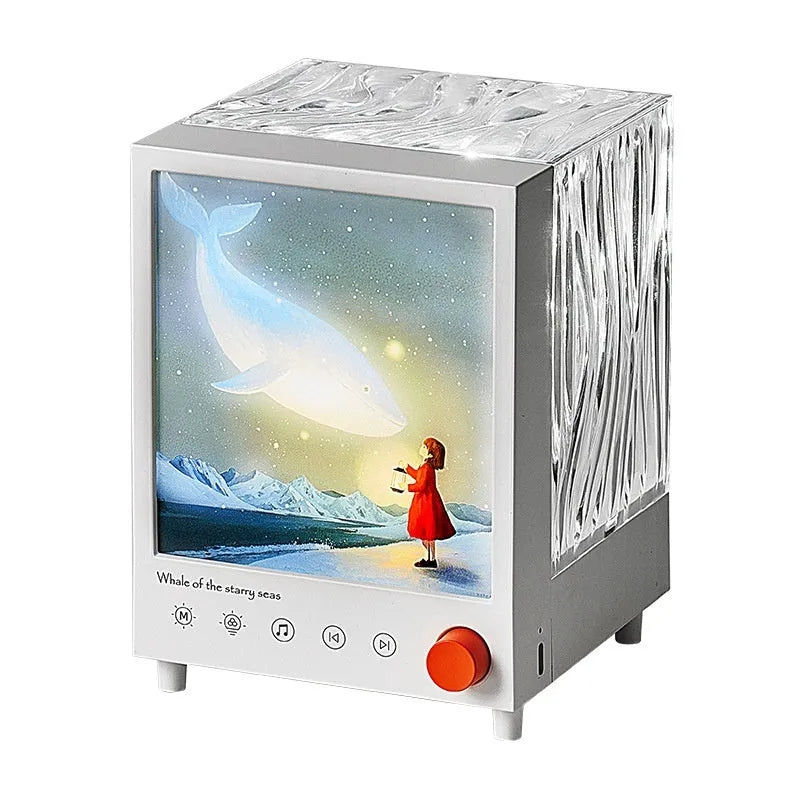 Aurora Treasure Box projection lamp projecting star sea whale light pattern, with Bluetooth speaker.