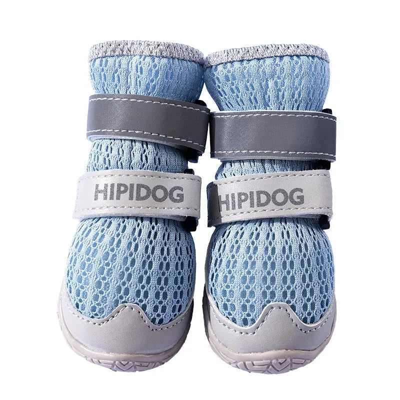 Pair of blue and green cartoon style dog shoes made from PU material on a white background.