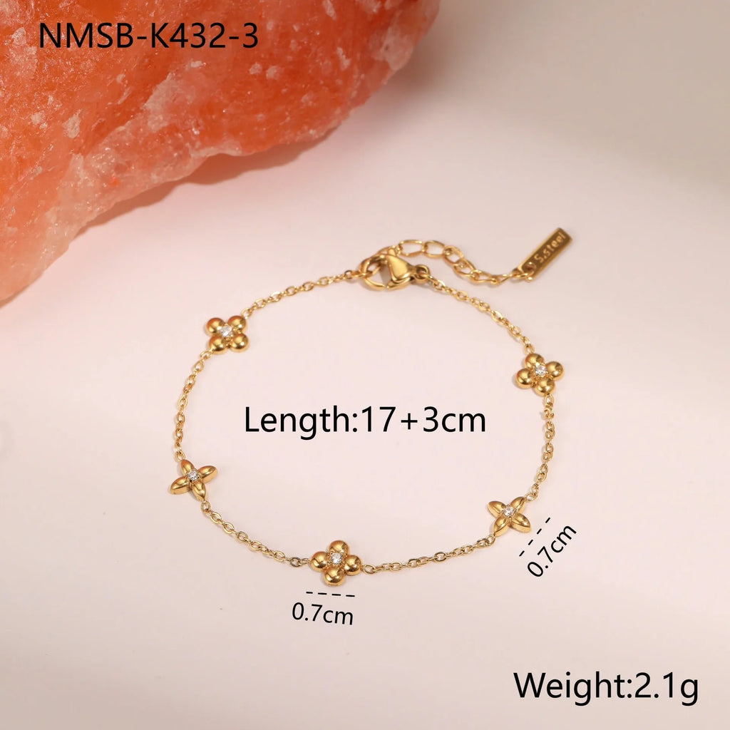 Women's stainless steel bracelet with a geometric star pendant, shown in gold and steel colour finishes.