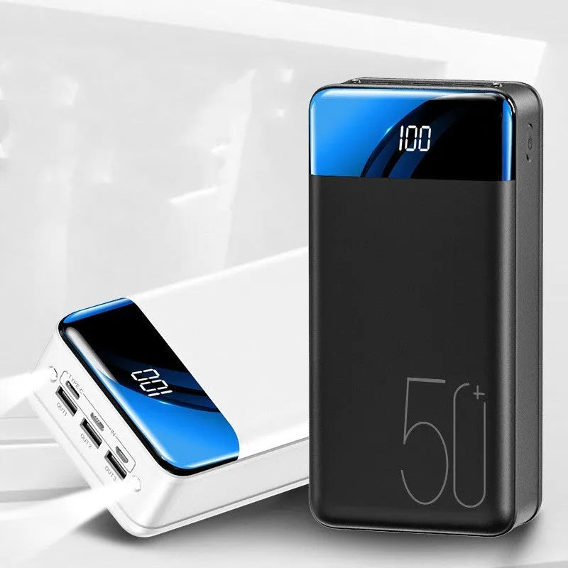 Black and white 50000mAh power bank showing three output USB ports and three input charging ports