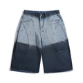 Blue loose-fit cropped jeans with a tie-dye gradient pattern and a mid-waist