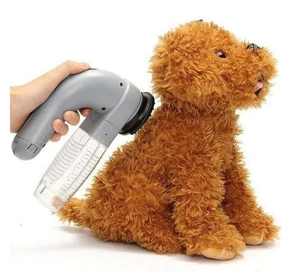 Grey portable electric pet hair vacuum cleaner with soft rubber brush head.