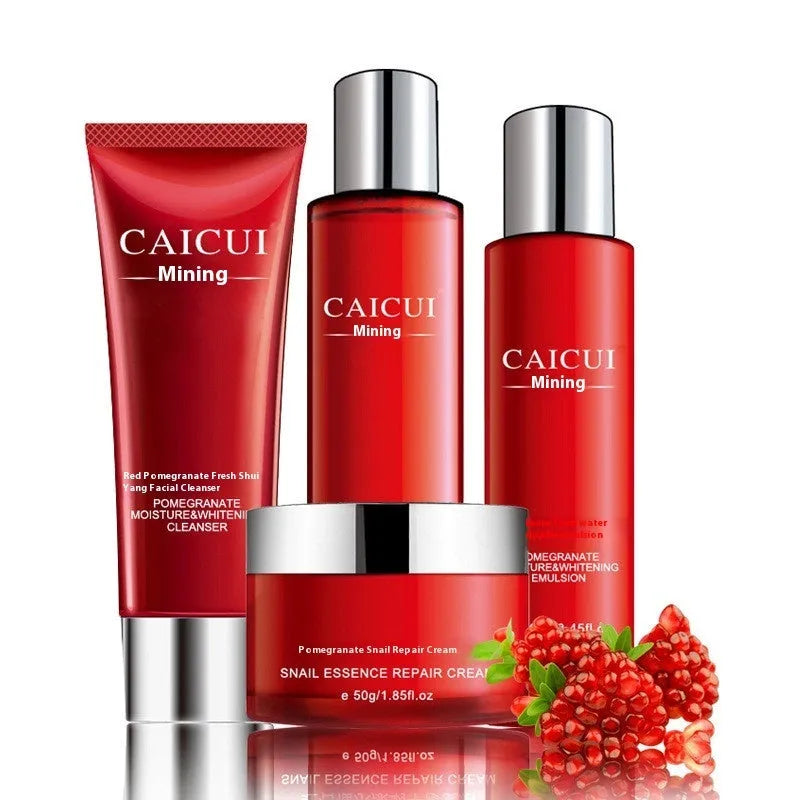 Pomegranate skincare set with four red packaged products: cleanser, toner, lotion and facial cream
