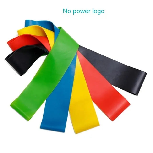 Five yoga resistance bands in different colours with varying thickness for progressive fitness training