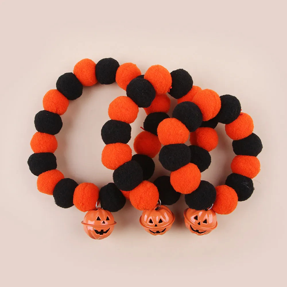 Orange Halloween pumpkin print cat collar with black cat silhouette and green stem.