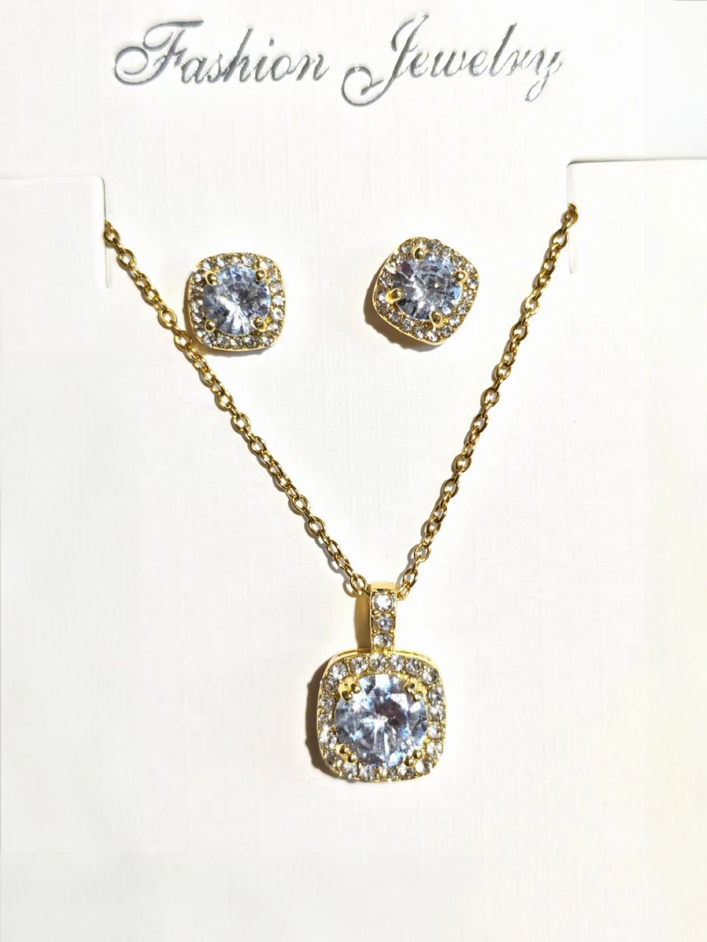 Women's minimalist square cubic zirconia necklace and earring set in gold finish on a light background