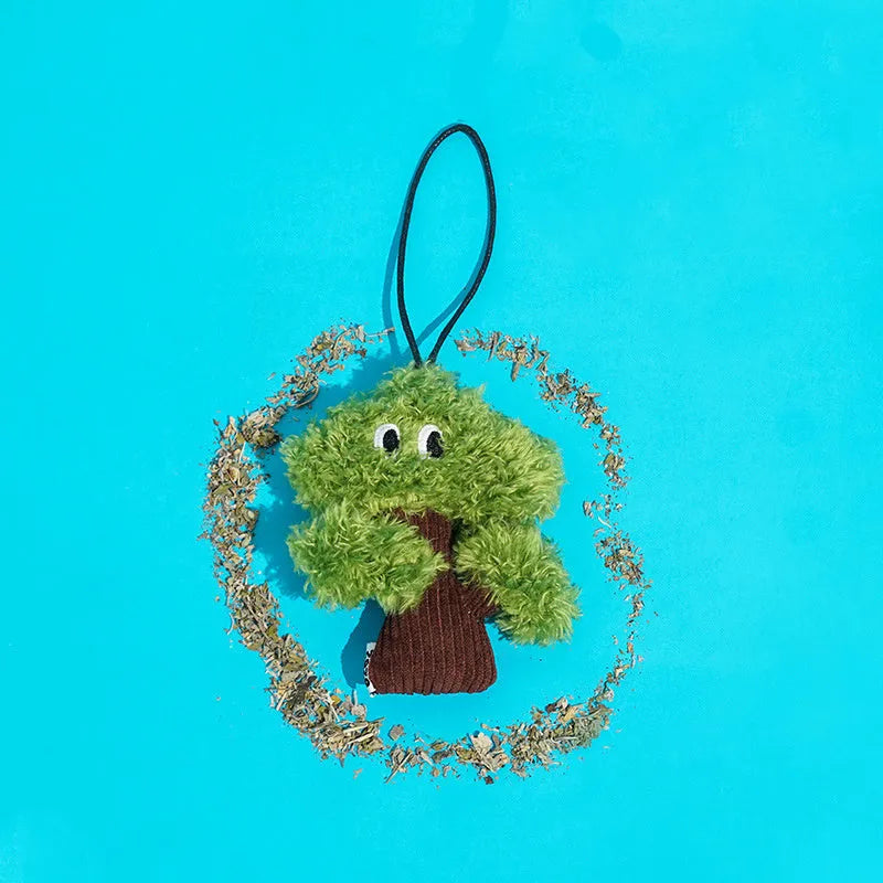 Green pine tree shaped cat toy pendant with a hanging loop, shown next to a tape measure indicating 12cm length.