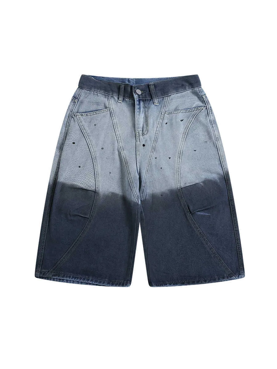 Blue loose-fit cropped jeans with a tie-dye gradient pattern and a mid-waist