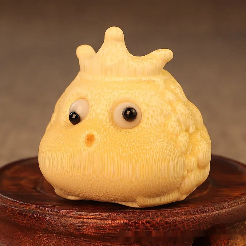 Hand-carved bamboo ornament of a cute Crown Princess toad with live eye detail