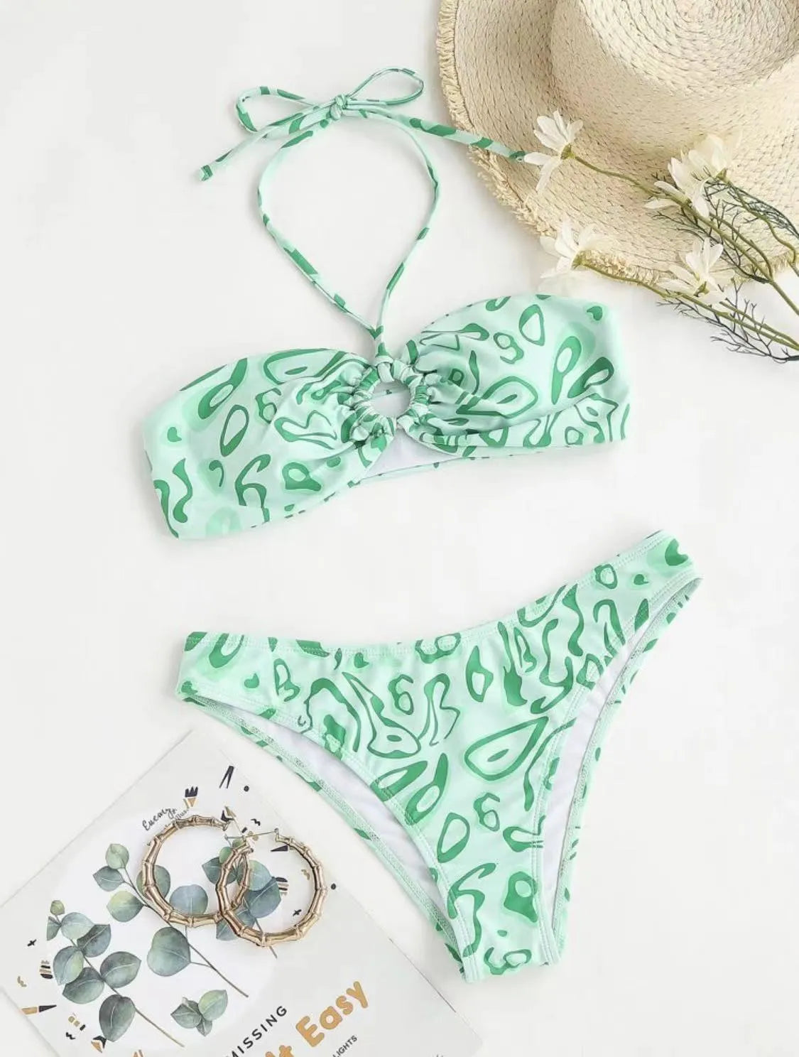 Women's blue floral bandeau bikini with split swimsuit design showing front and back views